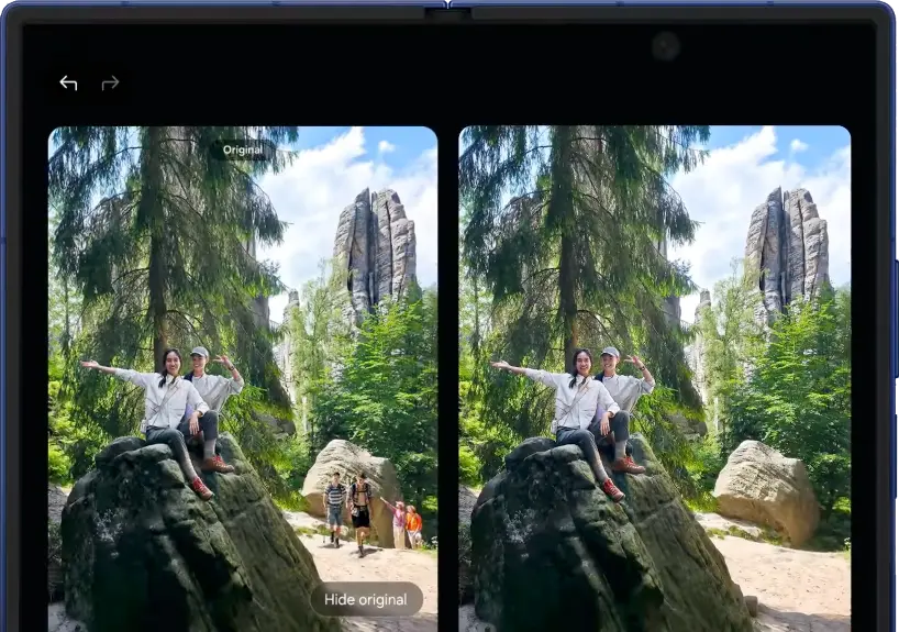 Két túrázó emberről készült fotó szerkesztése van folyamatban a Fotósegéd segítségével a Galaxy Z Fold7 fedőképernyőjén.
      A háttérben lévő többi személy ki van választva, és megnyomódik a Létrehozás gomb. A Galaxy AI törli őket. Kihajtva elrejtheted
      az eredetit, hogy teljes nézetben jobban lásd a szerkesztett fotót a nagy főképernyőn, vagy megjelenítheted az eredetit, hogy
      mindkét verziót egymás mellett lásd.